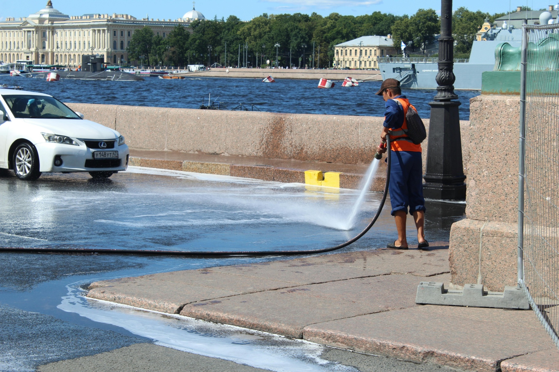 Pressure washing pro cleaning a sidewalk